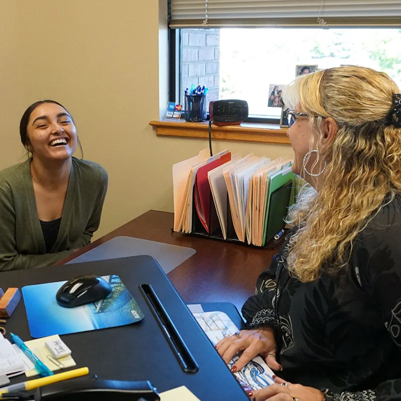 An agent at The Weese Insurance Agency reviewing coverage options with a client in the Littleton office